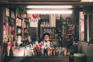 woman sitting in front of label container lot